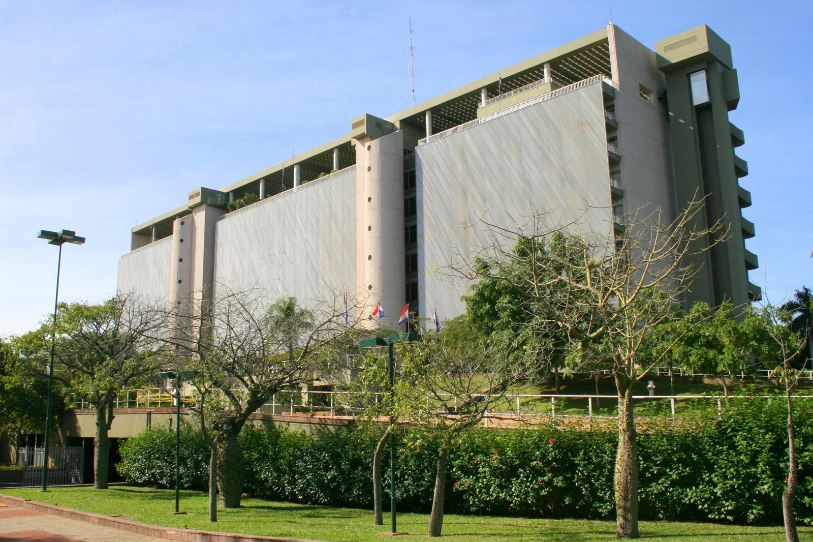 Bank building in Paraguay with gardens and Paraguayan flags